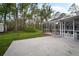 Spacious backyard with a screened-in patio and plenty of room for outdoor enjoyment at 1126 Oxbow Rd, Wimauma, FL 33598