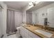 Bathroom featuring a tiled floor, granite counter, and modern fixtures at 1126 Oxbow Rd, Wimauma, FL 33598