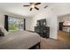 Primary bedroom with an ensuite and a view of the backyard at 1126 Oxbow Rd, Wimauma, FL 33598