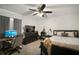 Cozy bedroom features a ceiling fan and carpeted floors at 1126 Oxbow Rd, Wimauma, FL 33598