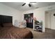 Bedroom features a crib, bed, carpet, and standard closet at 1126 Oxbow Rd, Wimauma, FL 33598