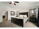 Bedroom with dark wood furniture, neutral carpet and natural light at 1126 Oxbow Rd, Wimauma, FL 33598