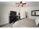 Bedroom featuring carpet, a ceiling fan and an ensuite bath at 1126 Oxbow Rd, Wimauma, FL 33598