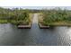 A personal boat dock on the river offers serene waterfront living and private access to aquatic adventures at 1126 Oxbow Rd, Wimauma, FL 33598