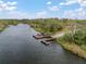 A private boat dock provides seamless access to the river, enhancing the property's recreational appeal and waterfront lifestyle at 1126 Oxbow Rd, Wimauma, FL 33598