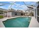 Enjoy the outdoors with a private pool, screened enclosure, and comfortable lounge seating at 1126 Oxbow Rd, Wimauma, FL 33598