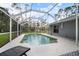 Backyard pool is screened in and features a patio, perfect for relaxing and enjoying the outdoors at 1126 Oxbow Rd, Wimauma, FL 33598