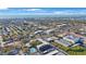 Wide aerial shot of the property's location with a peek of the sea and the city in the background at 11485 Oakhurst Rd # 111, Largo, FL 33774