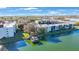 Aerial shot showcasing waterfront condos with boat dock, landscaping, and convenient parking with waterway access at 11485 Oakhurst Rd # 111, Largo, FL 33774