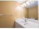 Bathroom featuring a large mirror, white vanity, and towel bar at 11485 Oakhurst Rd # 111, Largo, FL 33774