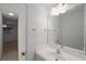 Well-lit bathroom featuring a modern vanity, large mirror, and neutral color palette, creating a clean and inviting space at 11485 Oakhurst Rd # 111, Largo, FL 33774