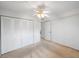 Neutral bedroom with fan and closet at 11485 Oakhurst Rd # 111, Largo, FL 33774