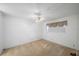 Neutral carpeted bedroom with a ceiling fan and a window, providing a comfortable and simple living space at 11485 Oakhurst Rd # 111, Largo, FL 33774