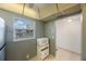 Compact kitchen with a microwave and view to the outdoors at 11485 Oakhurst Rd # 111, Largo, FL 33774