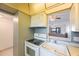 Cozy kitchen features a pass-through, ample counter space and a ceiling fan at 11485 Oakhurst Rd # 111, Largo, FL 33774