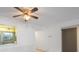Bright living room featuring an open layout, neutral paint, tile floors, and a ceiling fan with light at 11485 Oakhurst Rd # 111, Largo, FL 33774