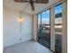 Bright sunroom with tiled floor, ceiling fan and large windows showcasing the outdoor landscape and natural light at 11485 Oakhurst Rd # 111, Largo, FL 33774
