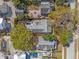 An aerial view of the property showcasing a patio, garden, and proximity to neighboring homes and street at 1205 13Th N St, St Petersburg, FL 33705