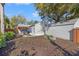 A charming backyard with a pergola-covered patio, featuring a spacious area for landscaping and outdoor enjoyment at 1205 13Th N St, St Petersburg, FL 33705
