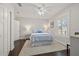 Bright bedroom features a ceiling fan, window with plantation shutters, and a plush rug at 1205 13Th N St, St Petersburg, FL 33705