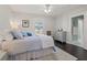 Comfortable bedroom features a cozy bed, white trim, and a ceiling fan at 1205 13Th N St, St Petersburg, FL 33705