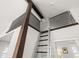 View of bonus room, ladder, and railing with natural wood accents at 1205 13Th N St, St Petersburg, FL 33705