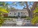 Charming single-story home with a white picket fence and lush landscaping at 1205 13Th N St, St Petersburg, FL 33705