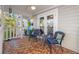 Cozy front porch with mosaic-tile flooring and comfortable seating at 1205 13Th N St, St Petersburg, FL 33705