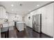 Bright kitchen featuring white cabinetry, stainless steel appliances, and a functional center island at 1205 13Th N St, St Petersburg, FL 33705