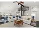 Bright living room with high ceilings, modern decor, and a unique loft ladder feature at 1205 13Th N St, St Petersburg, FL 33705