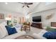 Bright living room with vaulted ceilings, a ceiling fan, and access to an outdoor patio at 1205 13Th N St, St Petersburg, FL 33705