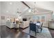 Open-concept living and dining area featuring vaulted ceilings and hardwood floors at 1205 13Th N St, St Petersburg, FL 33705