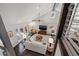 Bright living room boasts high ceilings, modern decor, a ceiling fan, and seamless access to the outdoors at 1205 13Th N St, St Petersburg, FL 33705