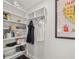 Well-organized pantry with shelving for food storage and accessories, plus a fun California print at 1205 13Th N St, St Petersburg, FL 33705