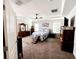 Large bedroom featuring trey ceilings, and a neutral color scheme at 12403 Brick Cobblestone Dr, Riverview, FL 33579