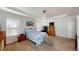 Spacious bedroom with tray ceiling, carpet, and a large window bringing in natural light at 12403 Brick Cobblestone Dr, Riverview, FL 33579