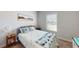 Bright bedroom featuring a comfortable bed and a large window bringing in natural light at 12403 Brick Cobblestone Dr, Riverview, FL 33579