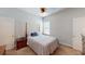 Cozy bedroom featuring a neutral color scheme, carpet flooring, and a comfortable bed at 12403 Brick Cobblestone Dr, Riverview, FL 33579