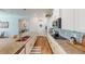 Well-lit kitchen with island and stainless steel appliances and a decorative backsplash at 12403 Brick Cobblestone Dr, Riverview, FL 33579