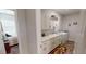 Bright laundry room featuring white cabinetry, countertops, washer, and dryer at 12403 Brick Cobblestone Dr, Riverview, FL 33579