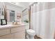 Bathroom featuring a shower with a curtain, and a single sink vanity at 1368 Noell Blvd, Palm Harbor, FL 34683