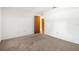 Bedroom with neutral carpet, and a door leading to the hallway at 1368 Noell Blvd, Palm Harbor, FL 34683