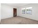 Bedroom with neutral carpet, a closet and large windows that provide natural light at 1368 Noell Blvd, Palm Harbor, FL 34683