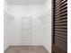 Walk-in closet with installed wire shelving for optimal storage solutions at 1368 Noell Blvd, Palm Harbor, FL 34683