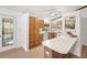 Well-lit kitchen with wood cabinetry, white countertops, and a view of the backyard through glass doors at 1368 Noell Blvd, Palm Harbor, FL 34683