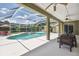 Stunning screened-in pool and patio area with comfortable seating, perfect for relaxation and entertaining at 1403 Crooked Stick Dr, Valrico, FL 33596