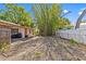 Backyard featuring bamboo trees, partial fencing, and ample space at 164 Nw Lincoln N Cir, St Petersburg, FL 33702