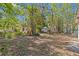 Lush trees enhance this backyard, which features a small structure at 164 Nw Lincoln N Cir, St Petersburg, FL 33702