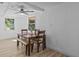 Cozy dining area with stylish furniture and a warm, inviting atmosphere for Gathering meals at 164 Nw Lincoln N Cir, St Petersburg, FL 33702