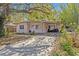 Charming single-story home featuring a covered carport and mature landscaping in a desirable neighborhood at 164 Nw Lincoln N Cir, St Petersburg, FL 33702
